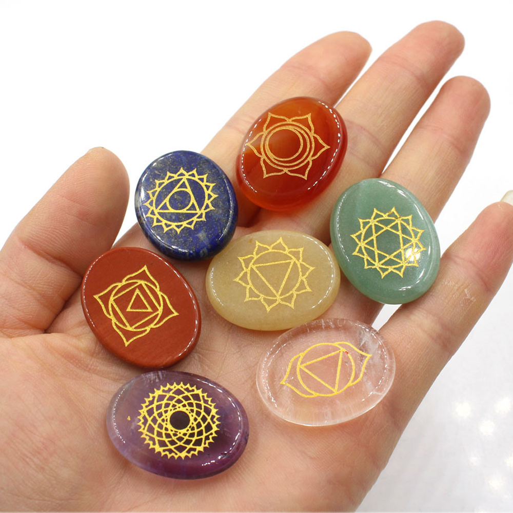 Chakra stone set - healing crystal with carved chakra symbols of oval stone chakra stone artifacts