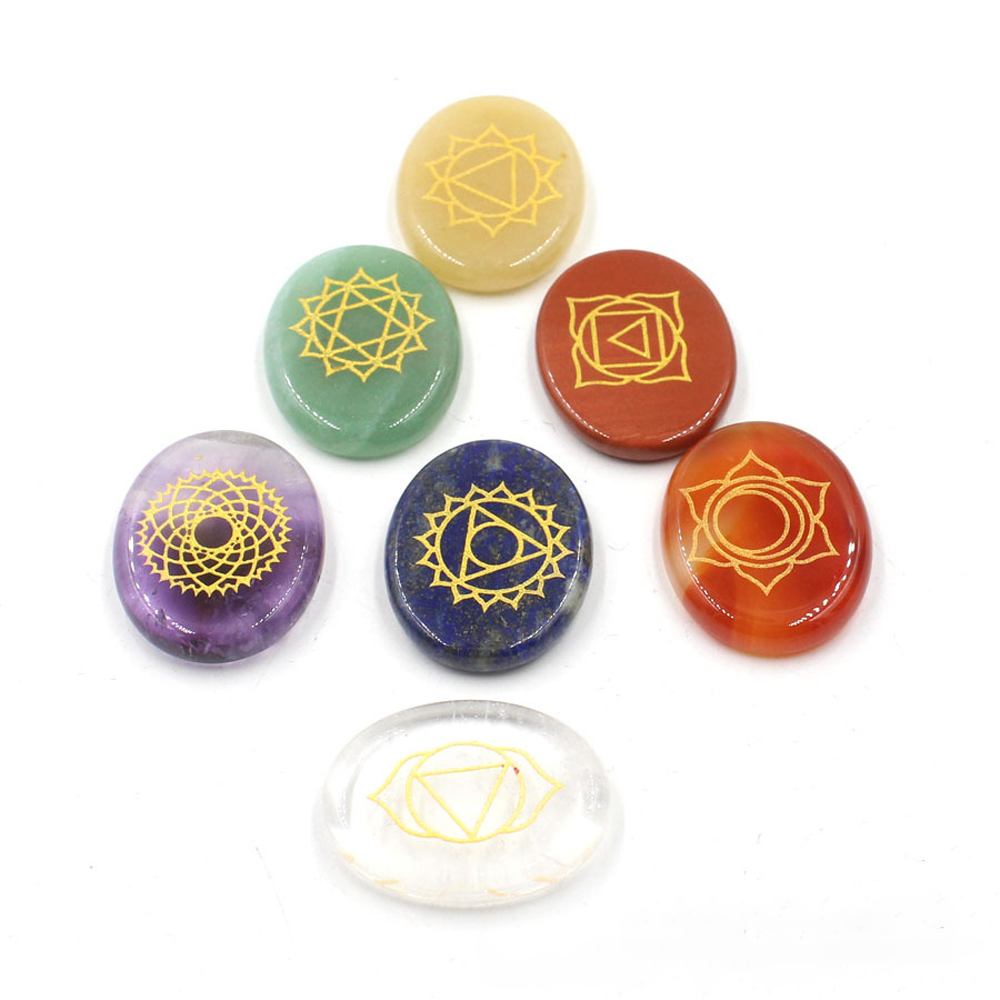 Chakra stone set - healing crystal with carved chakra symbols of oval stone chakra stone artifacts