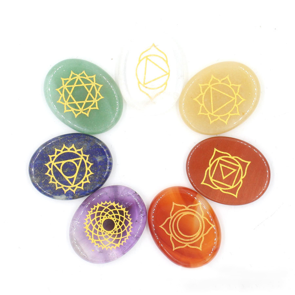 Chakra stone set - healing crystal with carved chakra symbols of oval stone chakra stone artifacts