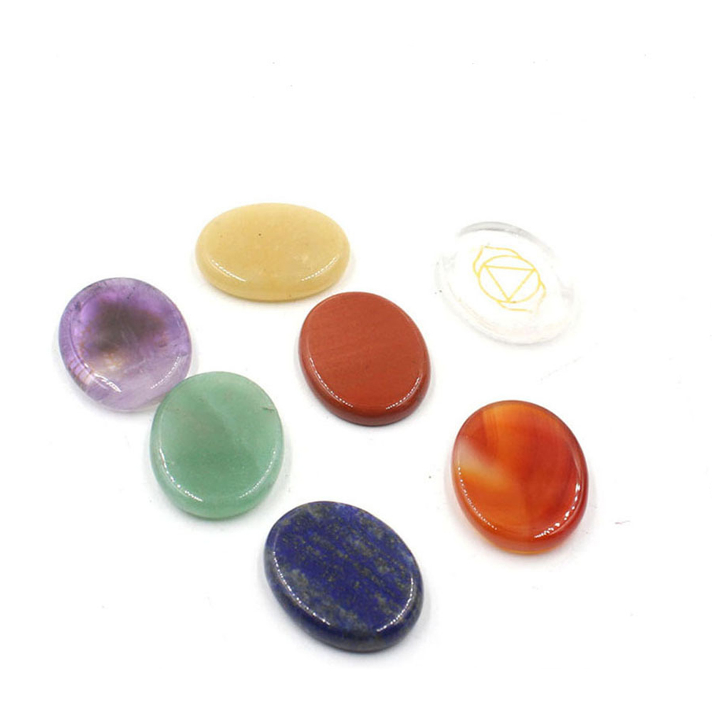 Chakra stone set - healing crystal with carved chakra symbols of oval stone chakra stone artifacts