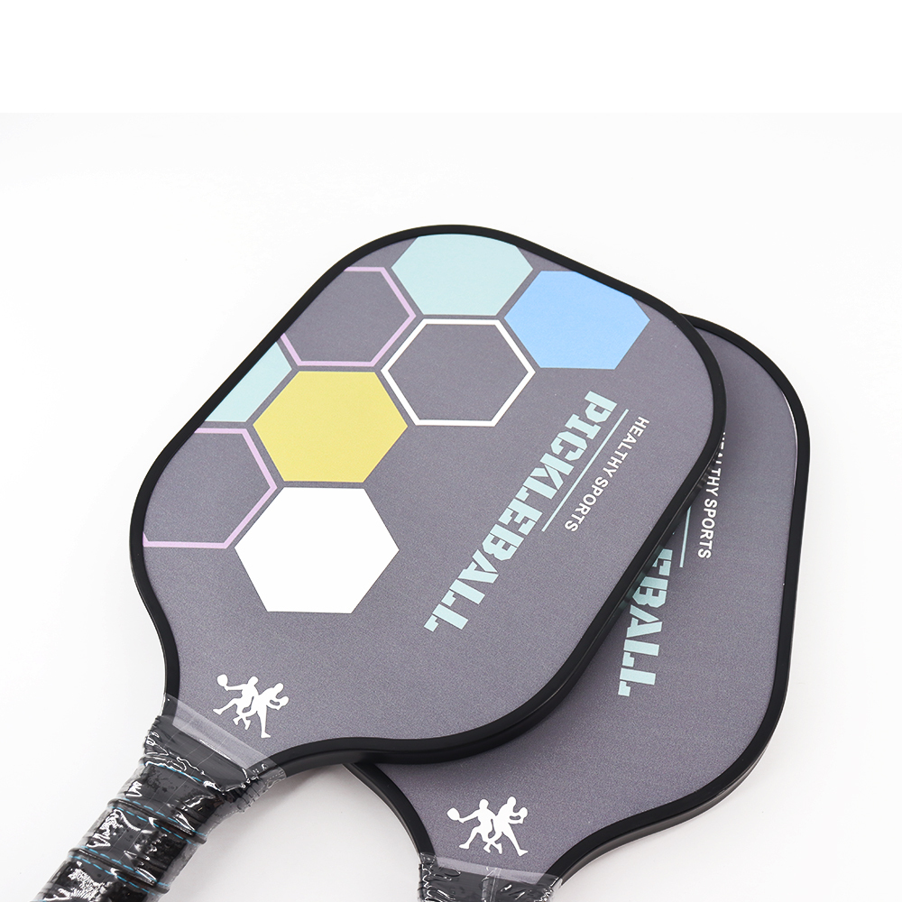 Durable pickleball paddle with shock absorbing carbon fiber 