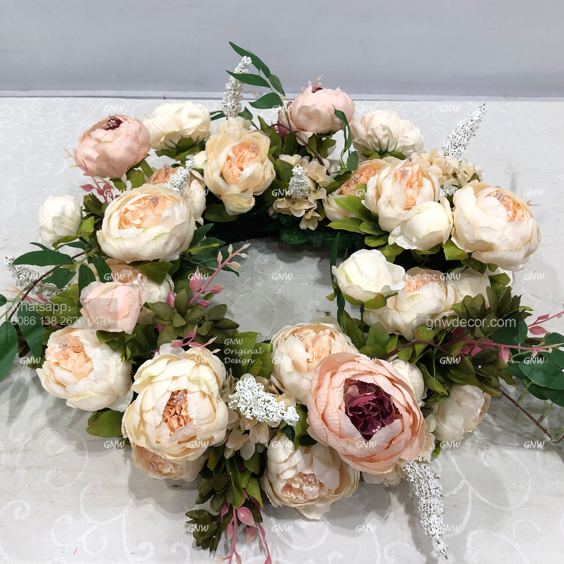 Artificial flower wreath
