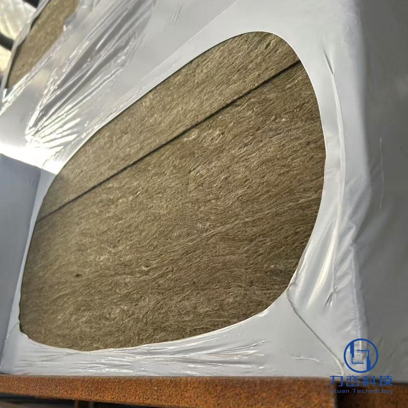 Black fireproof rock wool board stacked in warehouse with protective wrapping - high-density acoustic and fire insulation by Liluan Technology