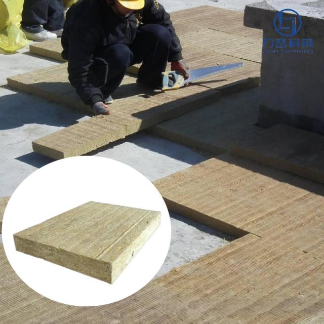On-site installation of walkable rock wool insulation boards on an industrial flat roof system.---LiLuan Technology
