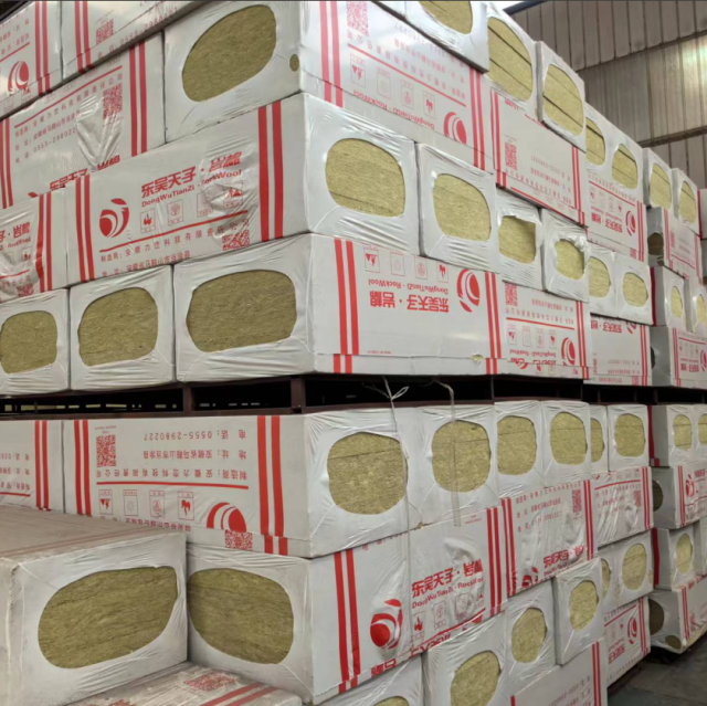 pallets of high-density rock wool boards wrapped in white export-standard plastic packaging with DongWuTianZi and Liluan Technology branding ready for shipment