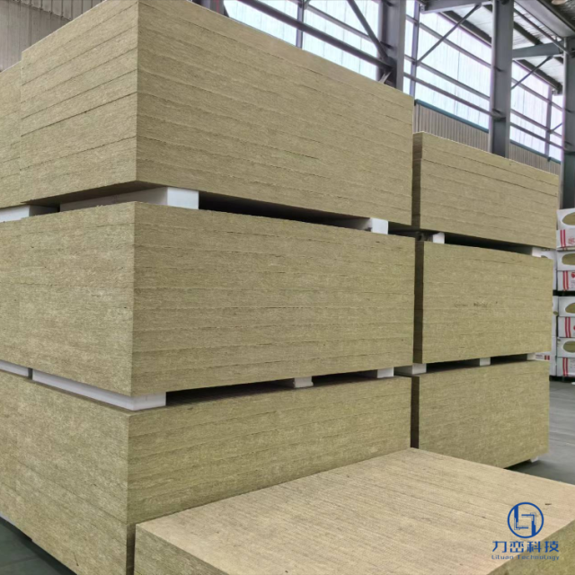 massive inventory of high-density rock wool roof boards stacked high on pallets in an organized warehouse with industrial structure