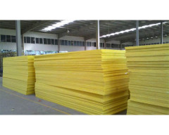 Massive warehouse stacks of glass wool boards – lightweight thermal & acoustic insulation ready for large-scale projects by Liluan Technology