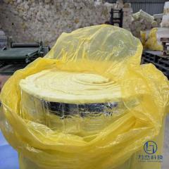 Glass wool blanket roll packaged in yellow shrink film showing aluminum foil facing – flexible thermal and acoustic insulation material by Liluan Technology