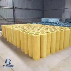 Hundreds of preformed glass wool pipe sections neatly arranged in warehouse – lightweight thermal & acoustic insulation stock by Liluan Technology