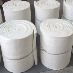 Multiple rolls of aluminum silicate blanket neatly stacked in warehouse – flexible high-temperature insulation material ready for shipment by Liluan Technology