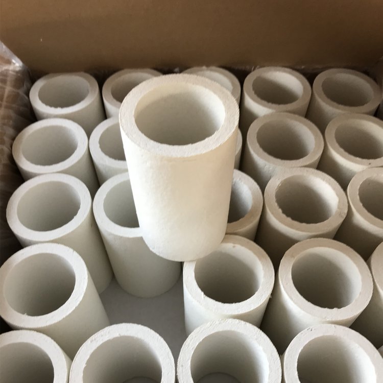 Bulk aluminum silicate pipes neatly packed in cardboard box – preformed high-temperature thermal insulation tubes ready for shipment by Liluan Technology