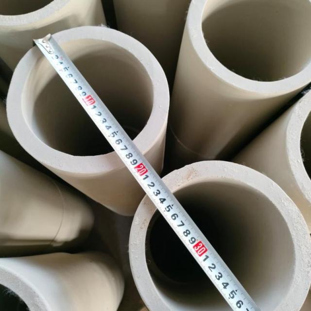 Close-up of aluminum silicate pipes with measuring tape showing precise inner diameter – high-temperature insulation pipe sections by Liluan Technology