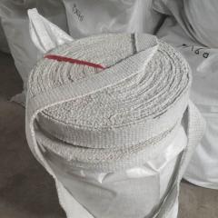 Rolled ceramic fiber textile tape secured with red strap – flexible high-temperature insulation fabric by Liluan Technology