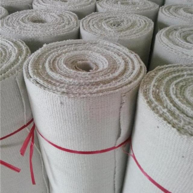 Multiple rolls of ceramic fiber textiles (cloth/blanket) neatly stacked in warehouse – high-temperature resistant insulation fabric by Liluan Technology