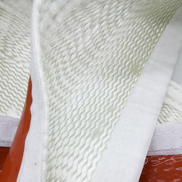 Close-up detail of the high-density white fiberglass weave and reinforced stitching of a buckle insulation sleeve, highlighting the heavy-duty hook-and-loop fastening edge---LiLuan Technology