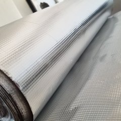 Extreme close-up of the fine grid pattern on the aluminum surface of a roll of AFGFC, showing the precise Fiber weave and a metallic straight edge for precision demonstration.---LiLuan Technology
