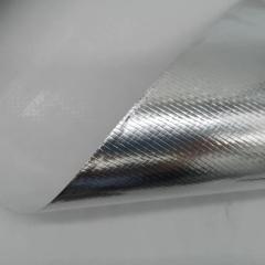 Close-up view of a sample corner of Liluan aluminum foil glass Fiber cloth, with the edge slightly curled to reveal the white fiberglass base beneath the textured aluminum layer.---LiLuan Technology