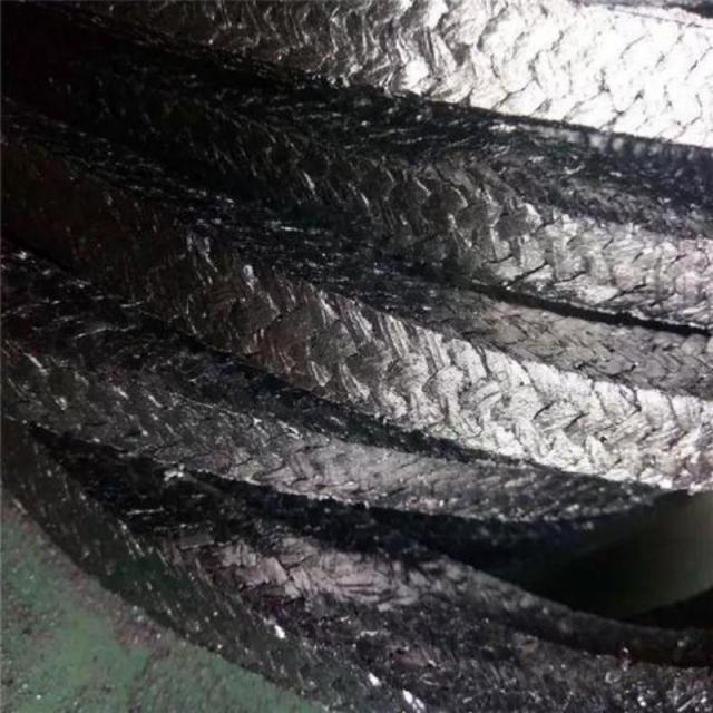 Close-up view of flexible graphite gland packing, showing the woven expanded graphite texture, ideal for high temperature and corrosive industrial sealing applications-LiLuan Technology