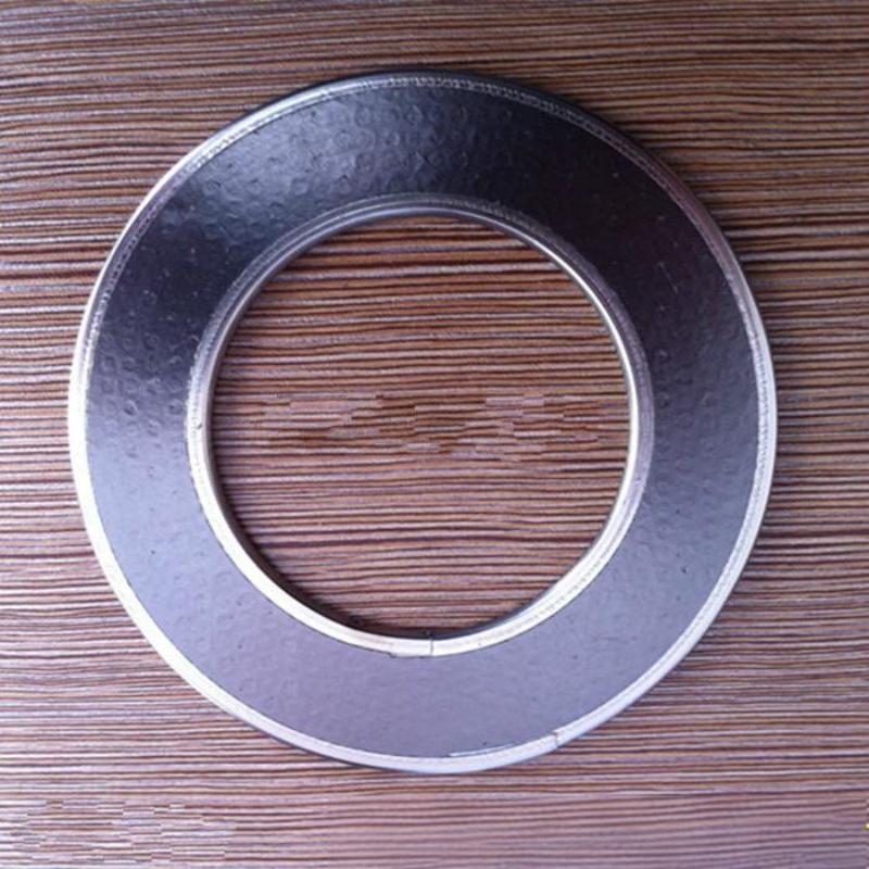 A precision macro photograph taken from above a single Liluan metal jacketed flexible graphite gasket, resting on a textured, lined surface. The shiny, precisely formed stainless steel outer ring is shown clearly encapsulating the dark, high-purity inner graphite ring, displaying construction quality.---LiLuan Technology