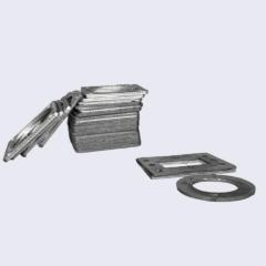 A studio photograph showcasing a neat stack of square tanged reinforced flexible graphite gaskets, with one square gasket and one round tanged gasket with exposed core displayed on the right, for diverse industrial pipe flange sealing applications.---LiLuan Technology