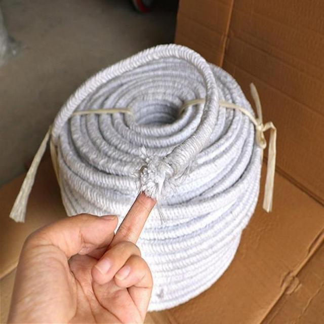 Handheld flexible ceramic fiber gland packing, showing the soft fiber texture, high temperature resistant sealing rope for industrial furnace and pipeline applications-LiLuan Technology