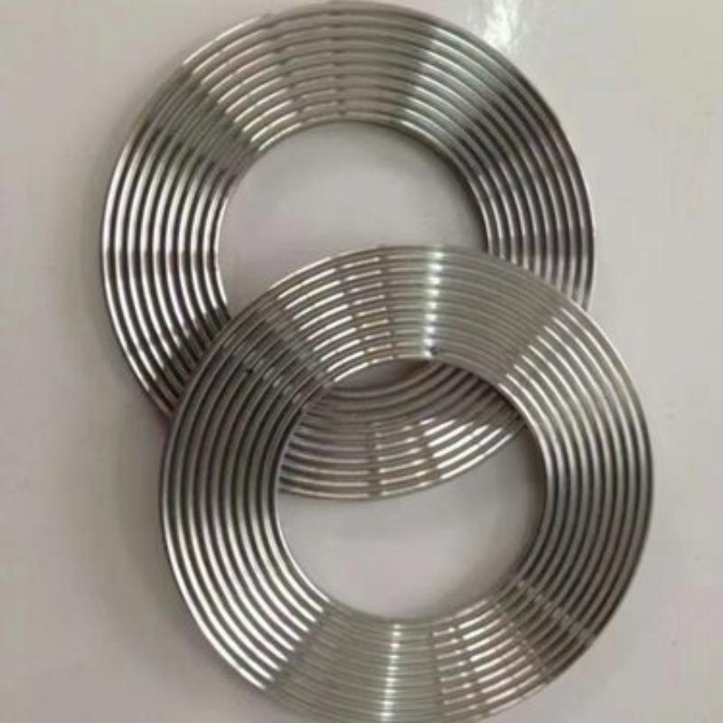 Close-up view of stainless steel corrugated (serrated) metal gasket with precision-machined concentric serrations, reliable high pressure flange sealing gasket.-LiLuan Technology