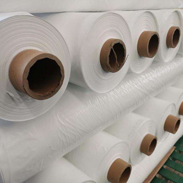 Close-up view of transparent PE heat shrink film rolls, polyethylene shrink wrap for industrial product packaging, moisture-proof and dust-proof protection-LiLuan Technology