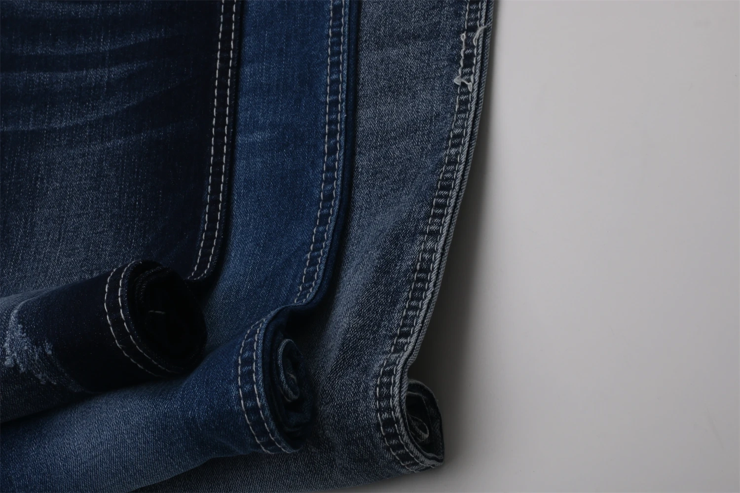 Chinese Factory Hot Sale High Elastic Dark Blue 9.2OZ Warp Slub Cotton/Poly/Spandex TR Denim Fabric for Jeans