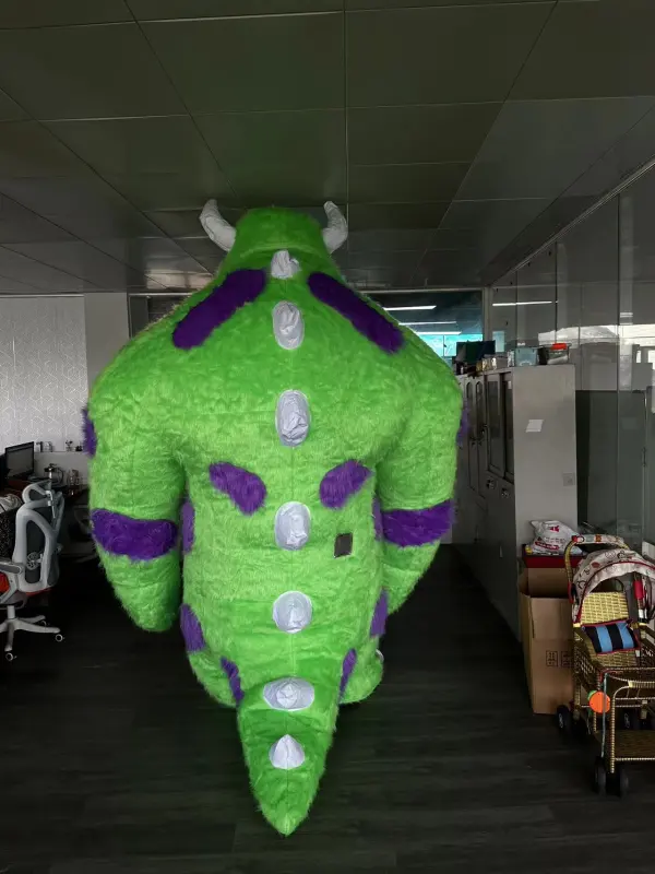 Green color Monsters University cartoon character James P. Sullivan inflatable sully mascot costume