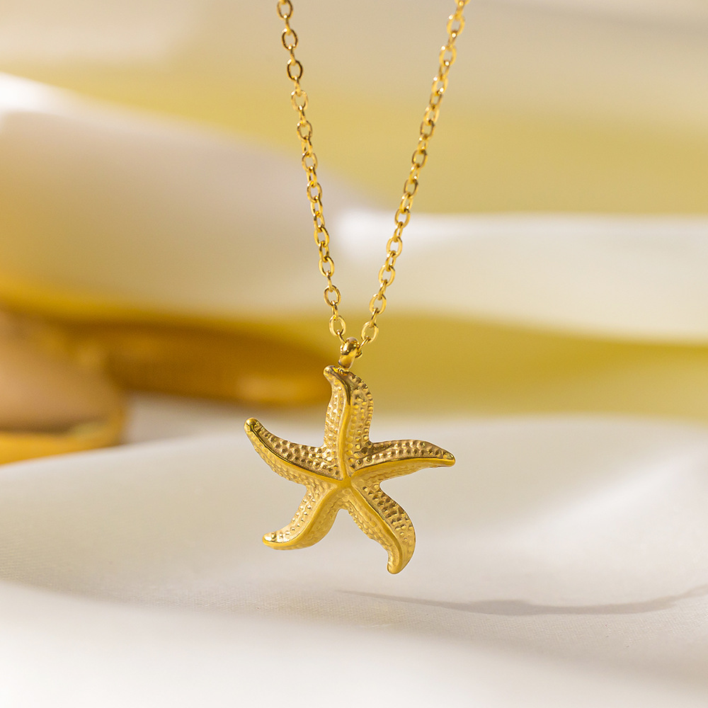 Estilo de vacaciones junto al mar de moda, clavícula de nicho, aretes y collar, colgante de estrella de mar, acero inoxidable, oro de 18 quilates que no se desvanece  ACRSS/27-80