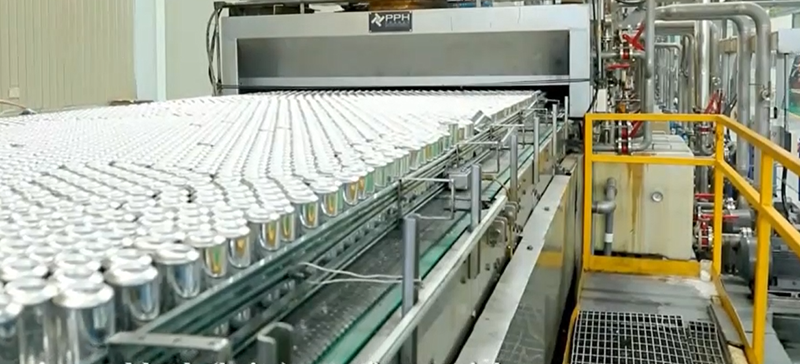 Automated high-speed production line at Baixi Industry featuring integrated manufacturing of energy drink cans and lids.