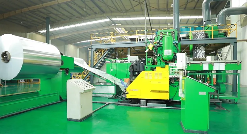 Inside an aluminum can manufacturing facility showing raw material input and forming processes