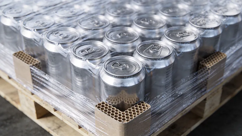 High-tension automated palletization of 330ml aluminum cans with honeycomb corner protectors and moisture-proof covers for safe rail transit.
