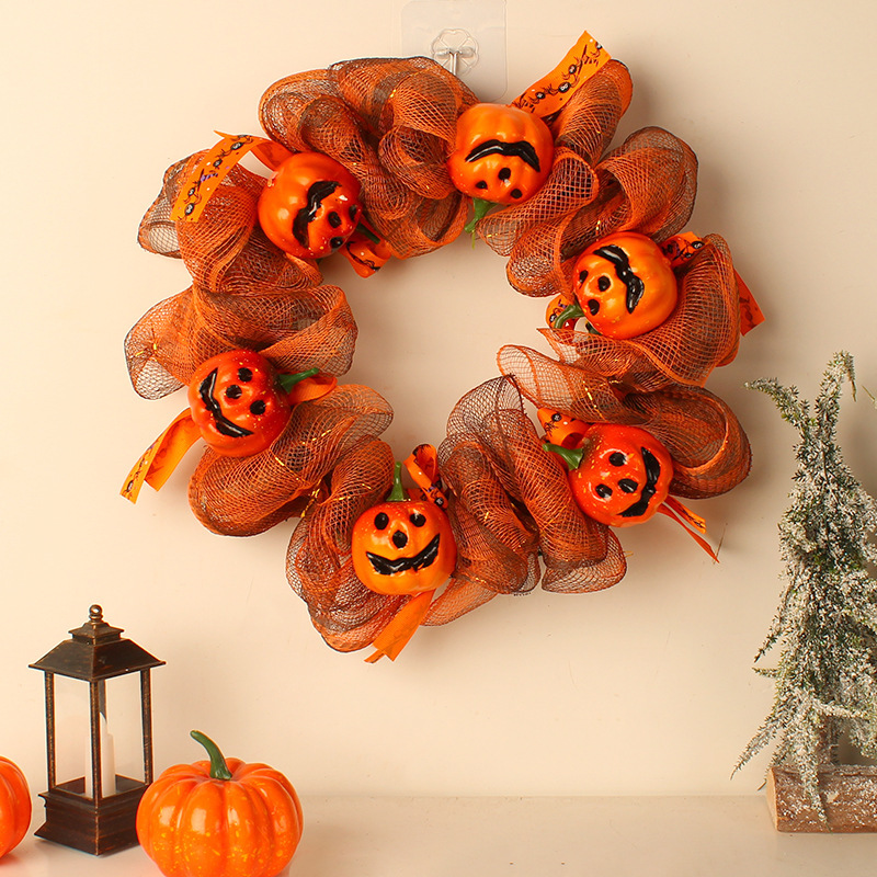 Hang a pumpkin net garland in front of your Halloween door