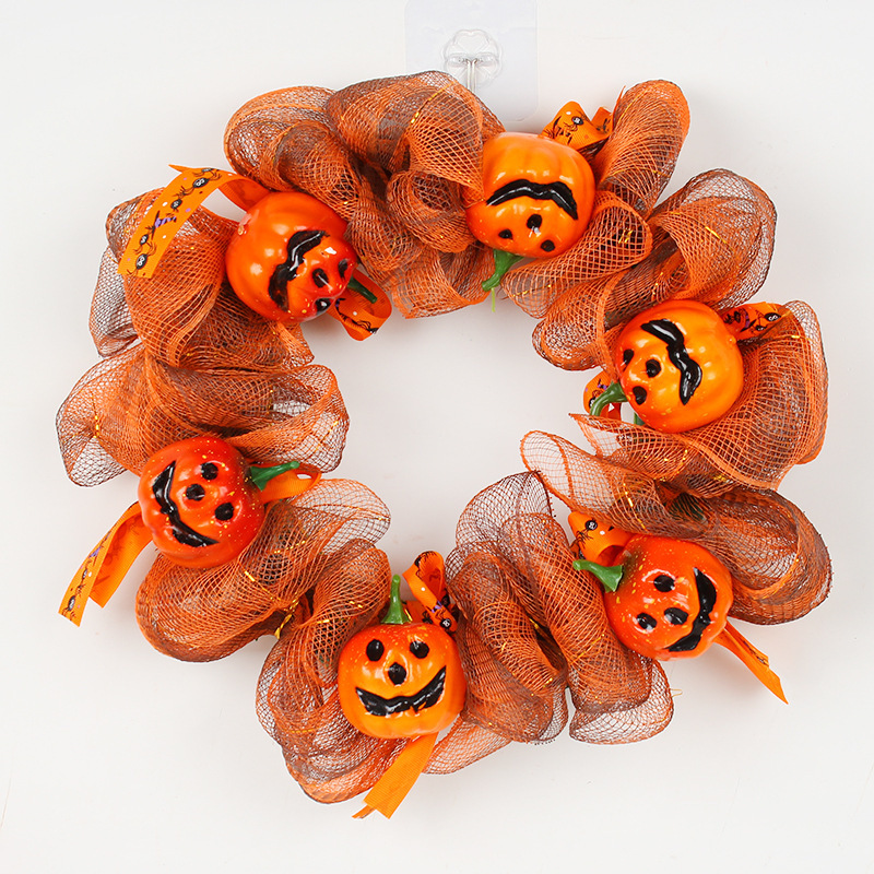 Hang a pumpkin net garland in front of your Halloween door