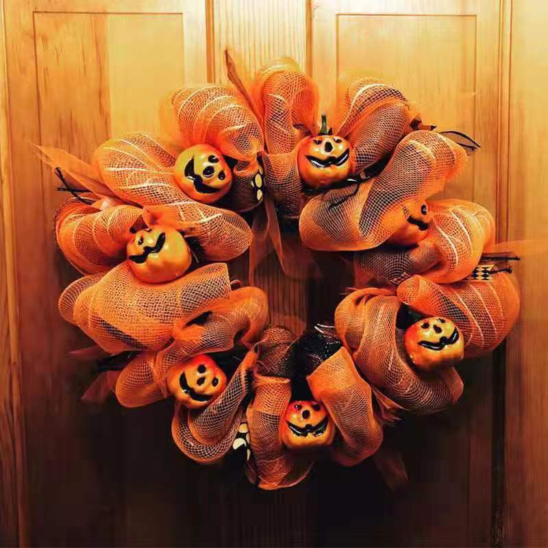 Hang a pumpkin net garland in front of your Halloween door