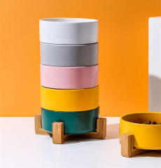 Assorted ceramic bowls for cats and dogs, with wooden stand