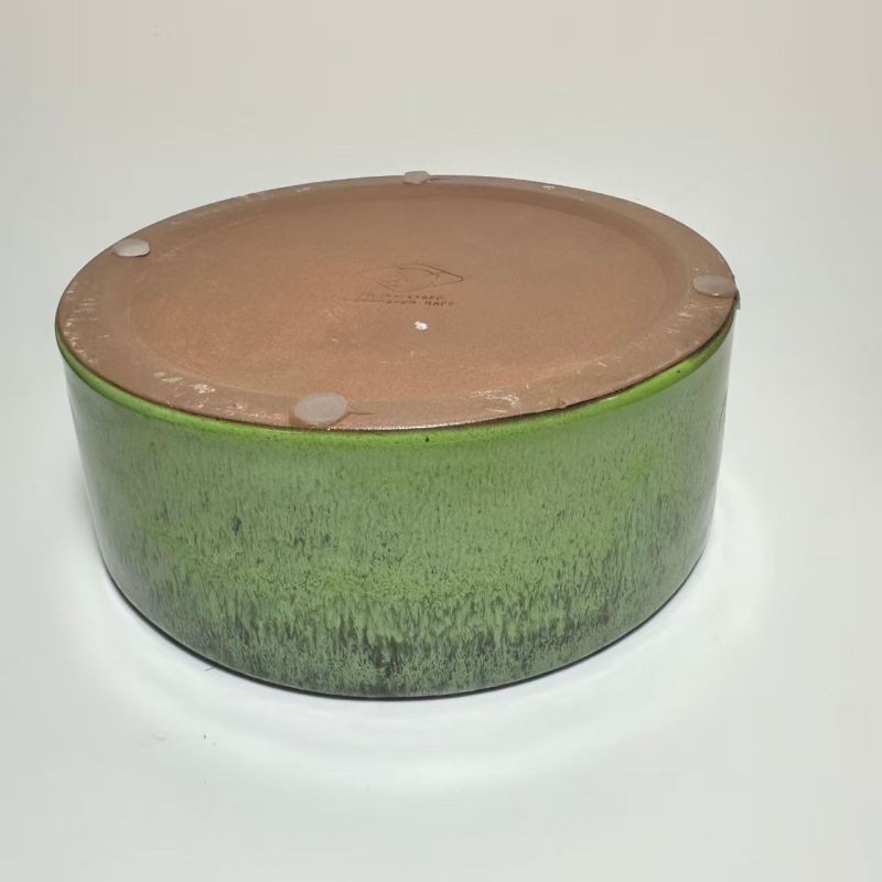 Pet-shaped purple clay pottery bowl