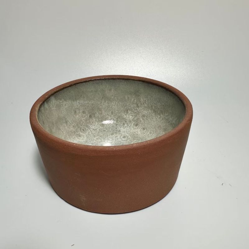 Pet-shaped purple clay pottery bowl