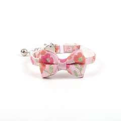 Gold-stamped bow cat collar with engraving