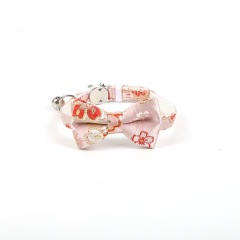 Gold-stamped bow cat collar with engraving