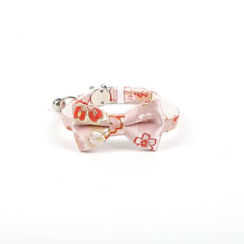 Gold-stamped bow cat collar with engraving