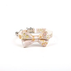 Gold-stamped bow cat collar with engraving