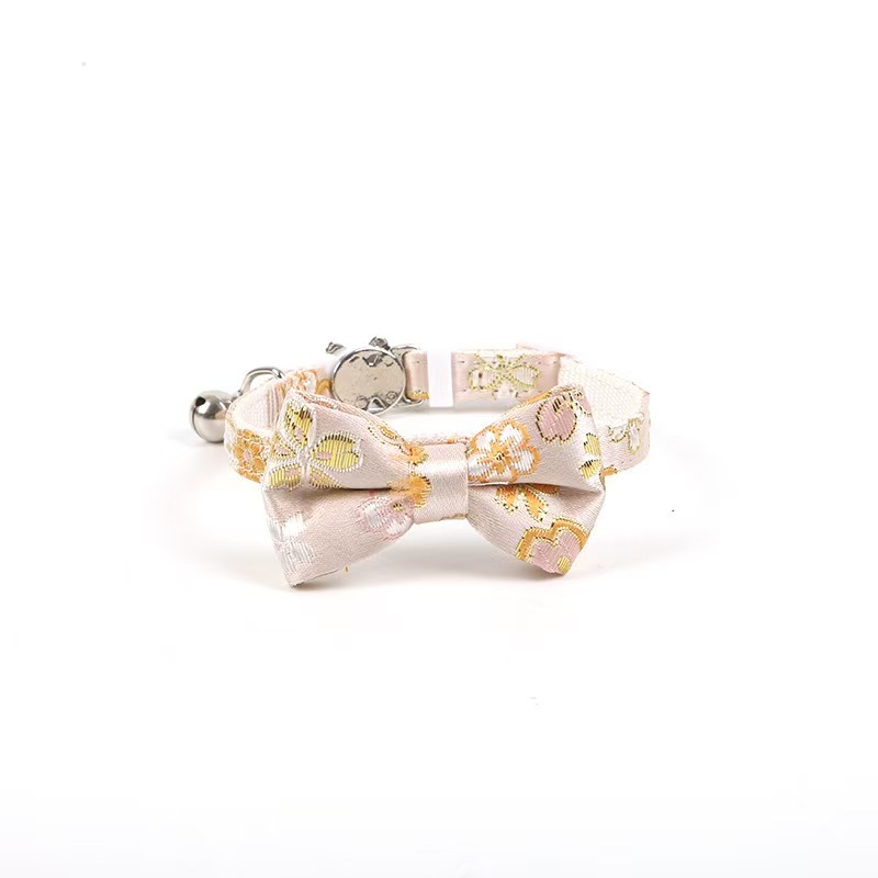 Gold-stamped bow cat collar with engraving