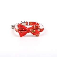 Gold-stamped bow cat collar with engraving