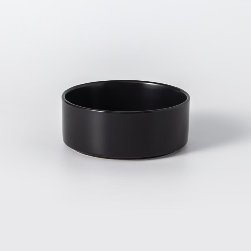 Assorted ceramic bowls for cats and dogs, with wooden stand