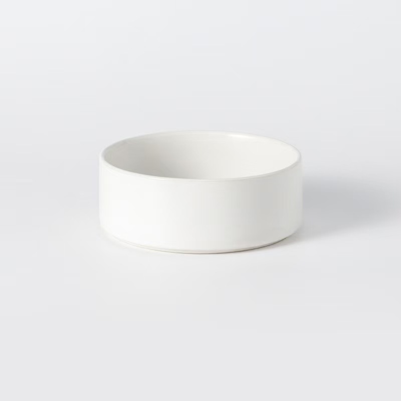 Assorted ceramic bowls for cats and dogs, with wooden stand