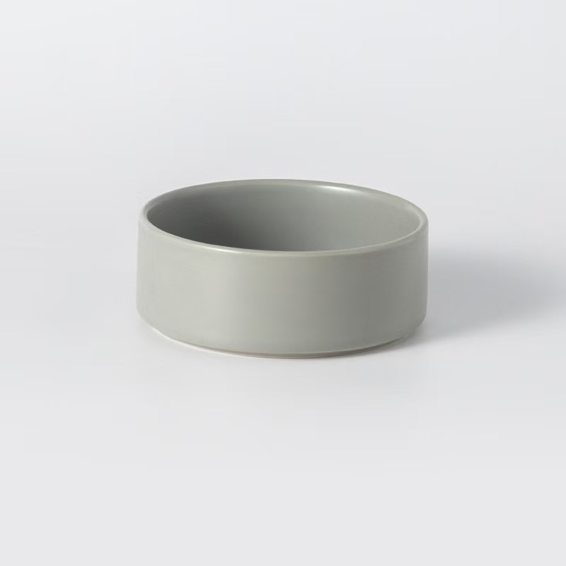 Assorted ceramic bowls for cats and dogs, with wooden stand
