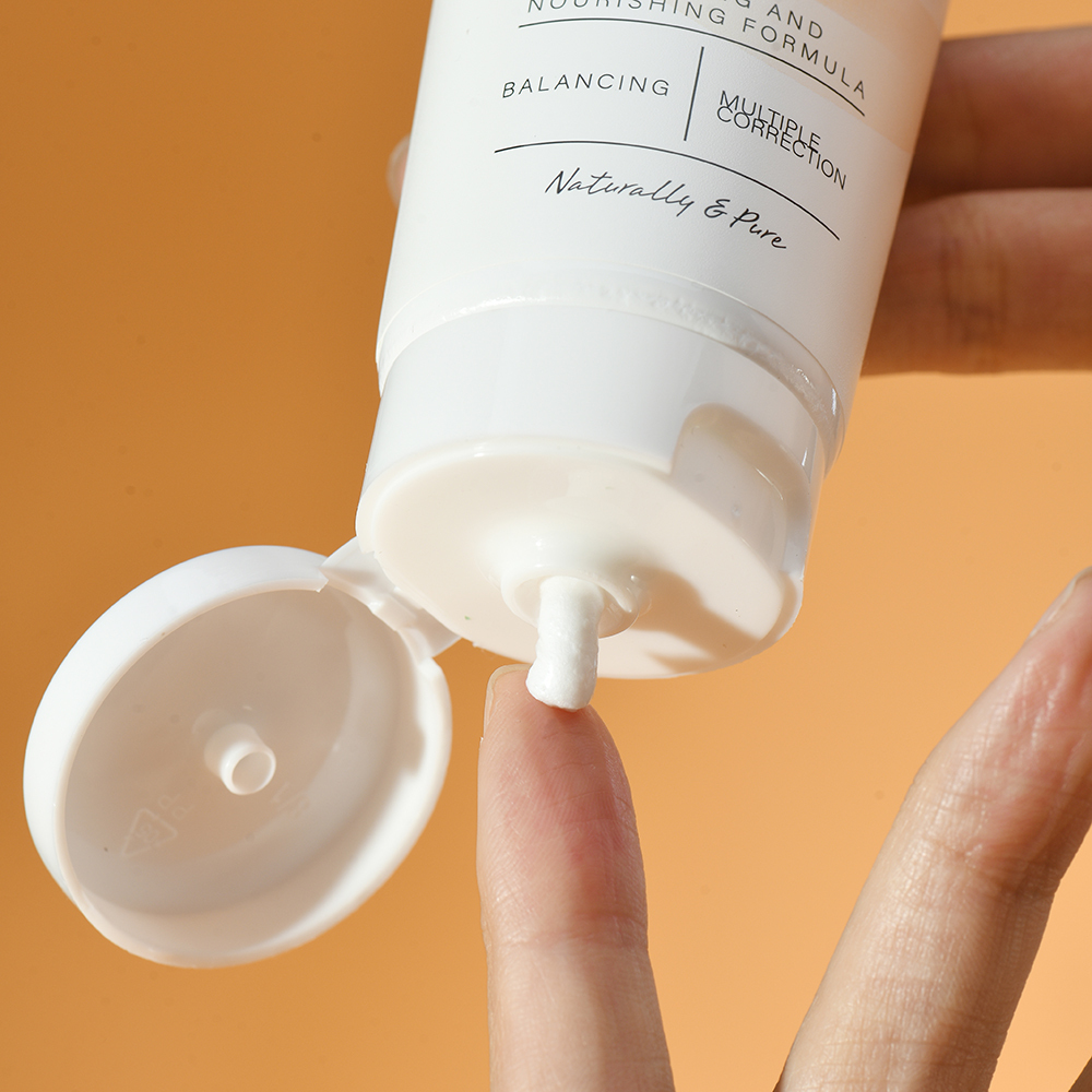 Person using Puramoria BHA Hyaluronic Acid Facial Cleanser, showing gentle application for deep cleansing.