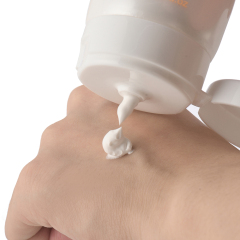 Person applying Daqan SPF60 Sunscreen for outdoor sun protection